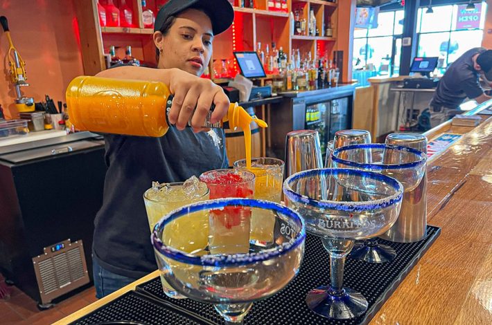 California Burrito's bartender mixing drinks at the bar