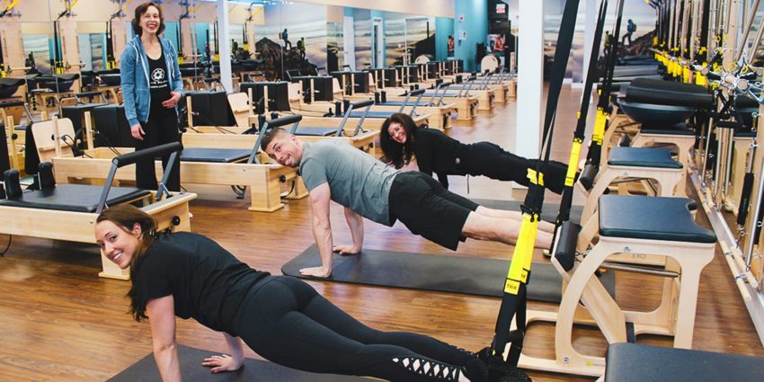 Linear Retail employees at Club Pilates, working out with their staff members