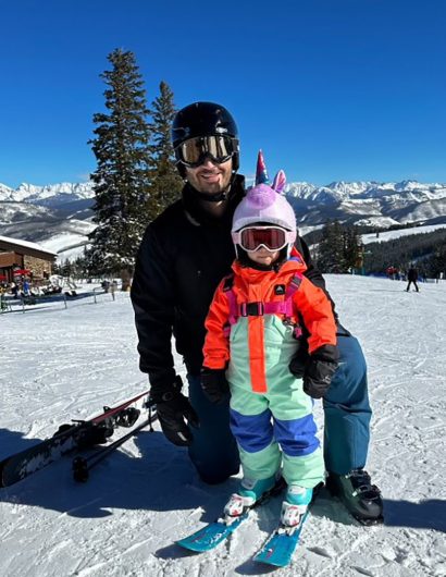 Greg and his daughter skiing together