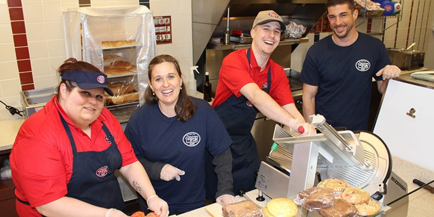 Jersey Mike's employees smiling at camera