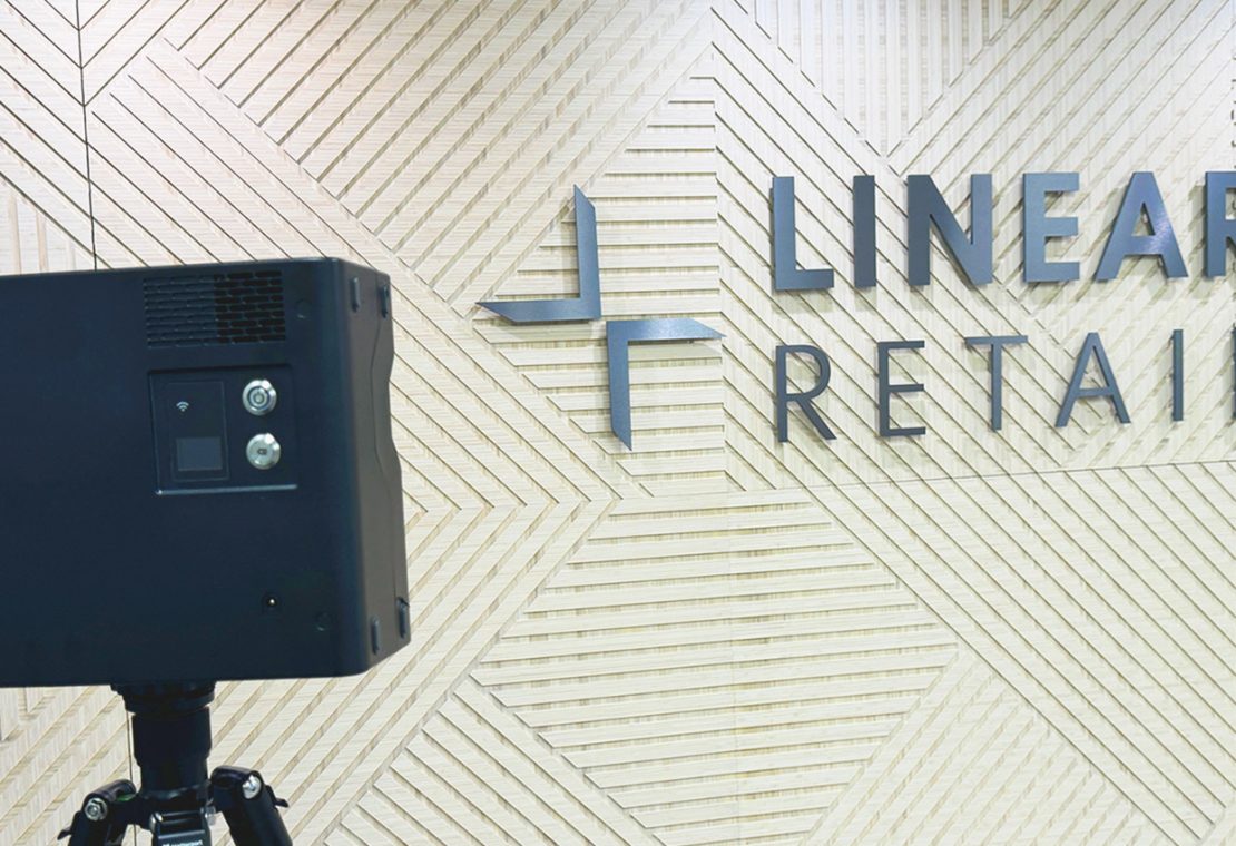 Matterport camera in front of Linear Retail logo